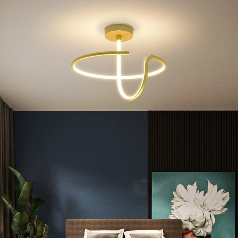 Alyona ceiling light by Residence Supply featuring a modern design with a sleek metal finish and glass shade.