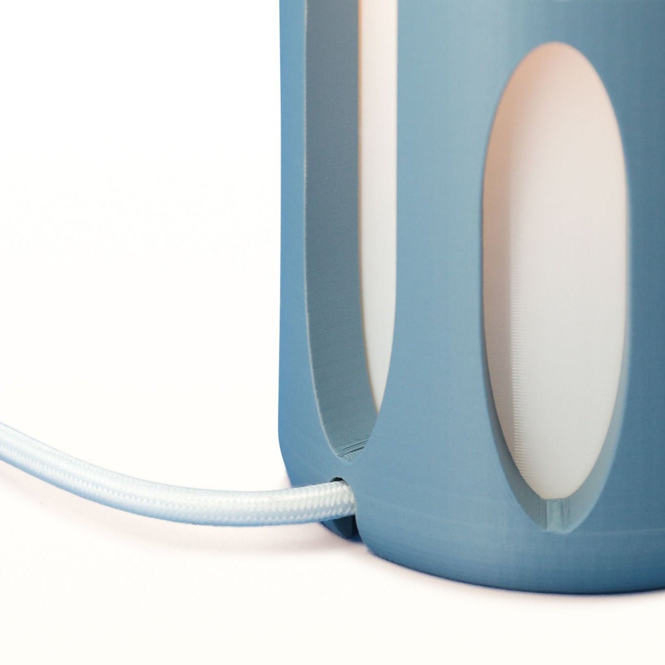 Terra Labs Amoeba Table Lamp with organic, amoeba-shaped design and textured surface on a wooden table.