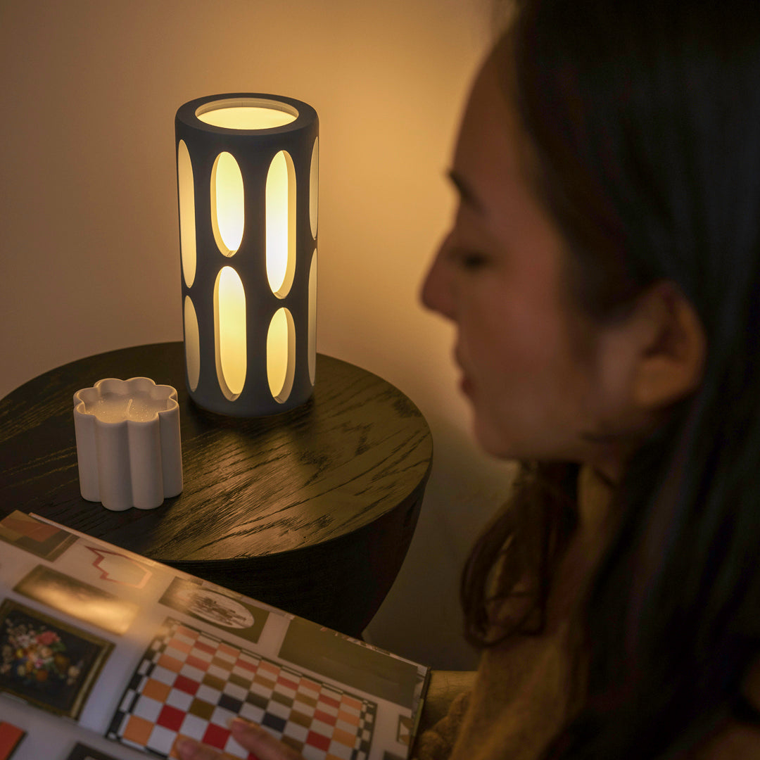 Terra Labs Amoeba Table Lamp with organic, amoeba-shaped design and smooth white finish on a wooden side table.