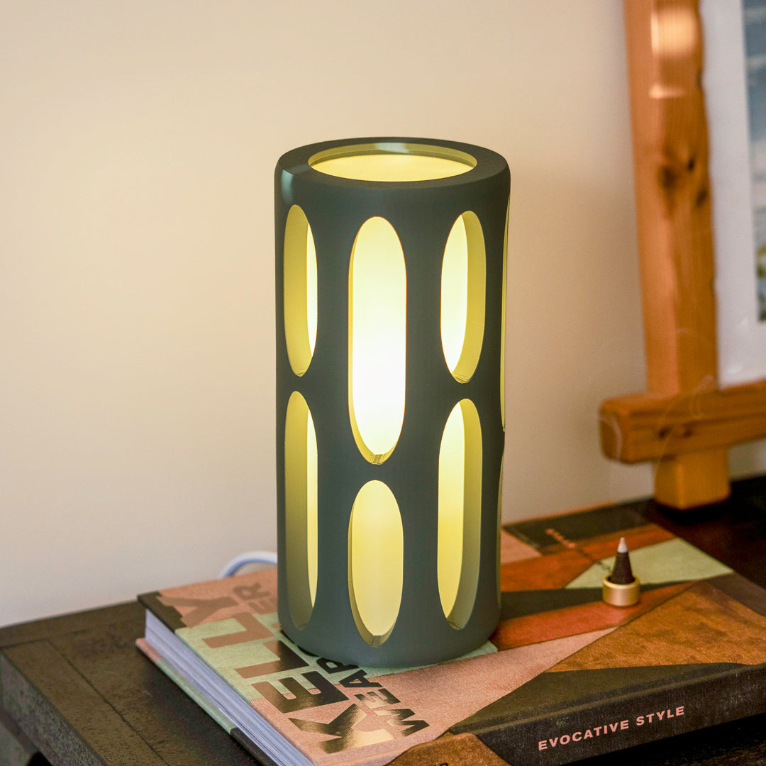 Terra Labs Amoeba Table Lamp with organic, amorphous glass shade and sleek metal base, modern lighting for living spaces.