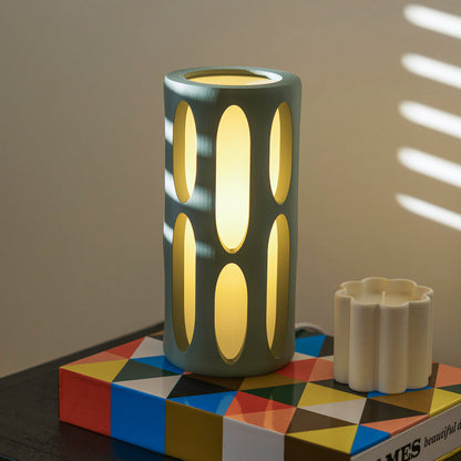 Mint-colored Terra Labs Amoeba Table Lamp with a unique organic shape and sleek design, perfect for modern home decor.