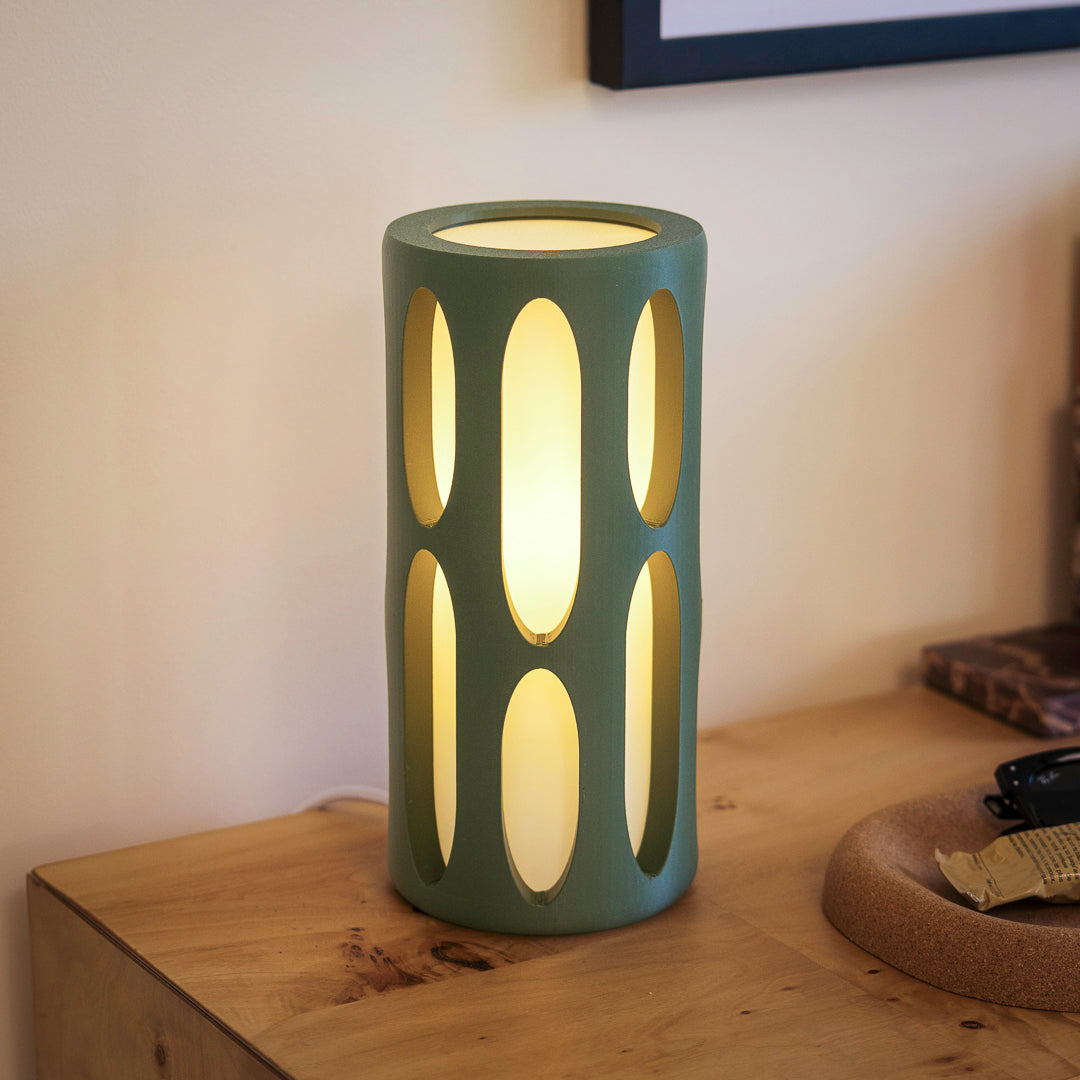 Olive green Terra Labs Amoeba Table Lamp with organic, amoeba-shaped design and smooth surface.