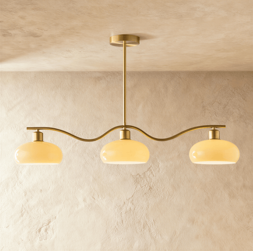 Elegant Ampix chandelier by Residence Supply featuring multiple hanging glass shades and a sleek modern design.