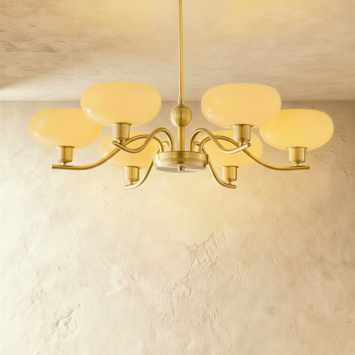 Ampix chandelier by Residence Supply featuring multiple glass globes and modern design hanging from a sleek metal frame.