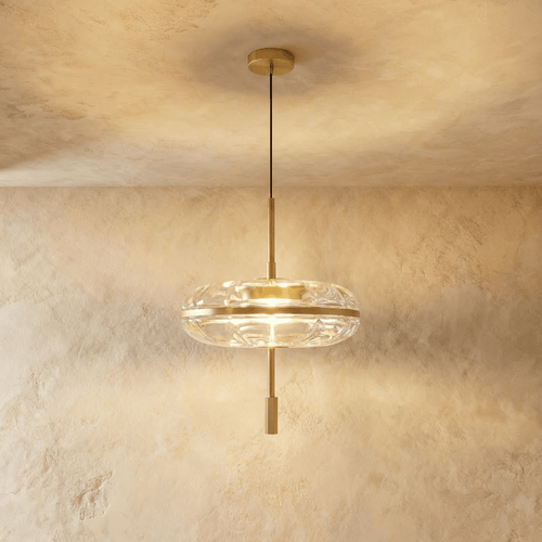 Anala Pendant Light by Residence Supply hanging from ceiling with a modern design and metal finish in a stylish interior setting.