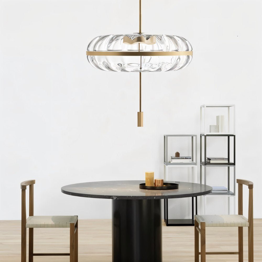 Sculptural glass Anala Pendant Light by Residence Supply hanging over a dining area, showcasing its artistic design.
