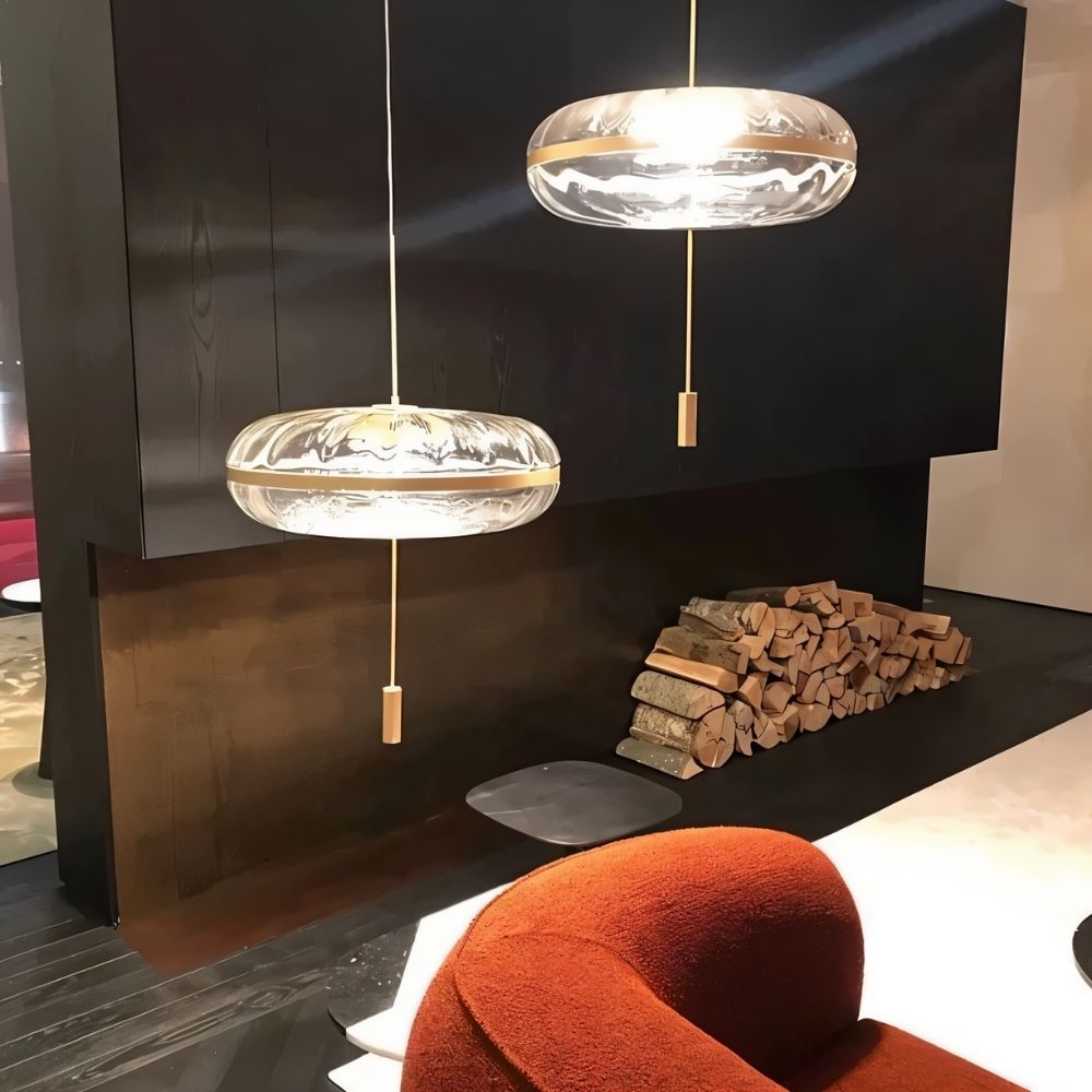 Sculptural Anala Pendant Light by Residence Supply hanging in a living room with glass design and modern decor.