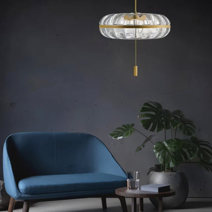 Sculptural glass Anala Pendant Light by Residence Supply hanging in a living space, showcasing its modern, artistic design.