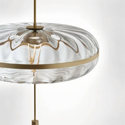 Sculptural glass Anala Pendant Light by Residence Supply hanging with textured glass shade and modern design.