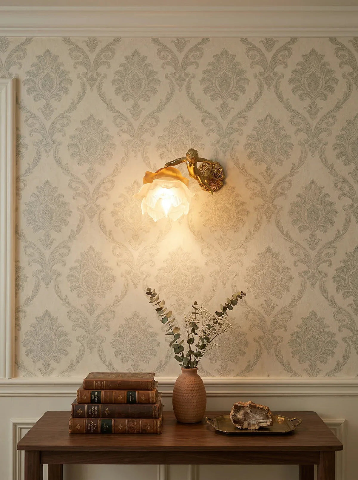 Korewolamp angel glass wall light illuminating a modern wall with a delicate angel design and soft ambient glow.
