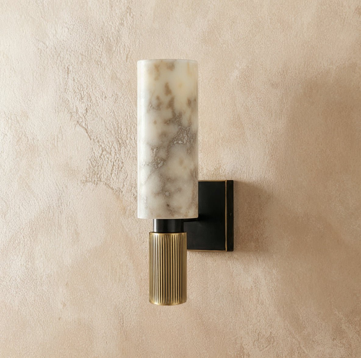 Ansu Alabaster Wall Lamp by Residence Supply featuring a sleek alabaster shade mounted on a modern wall fixture.