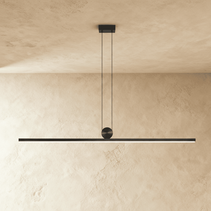 Modern Arlo pendant light by Residence Supply with a sleek metal finish and adjustable hanging cord, ideal for contemporary interiors.