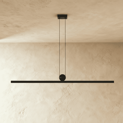 Modern Arlo Pendant Light by Residence Supply with a sleek, minimalist design and a metal finish, hanging from a ceiling fixture.