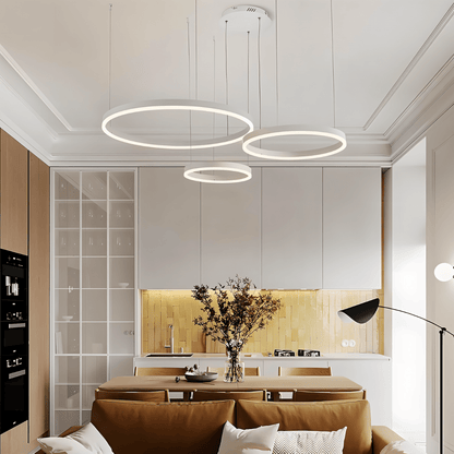 Elegant Aryana Chandelier with intricate metal design and multiple glass light fixtures, hanging from a ceiling.