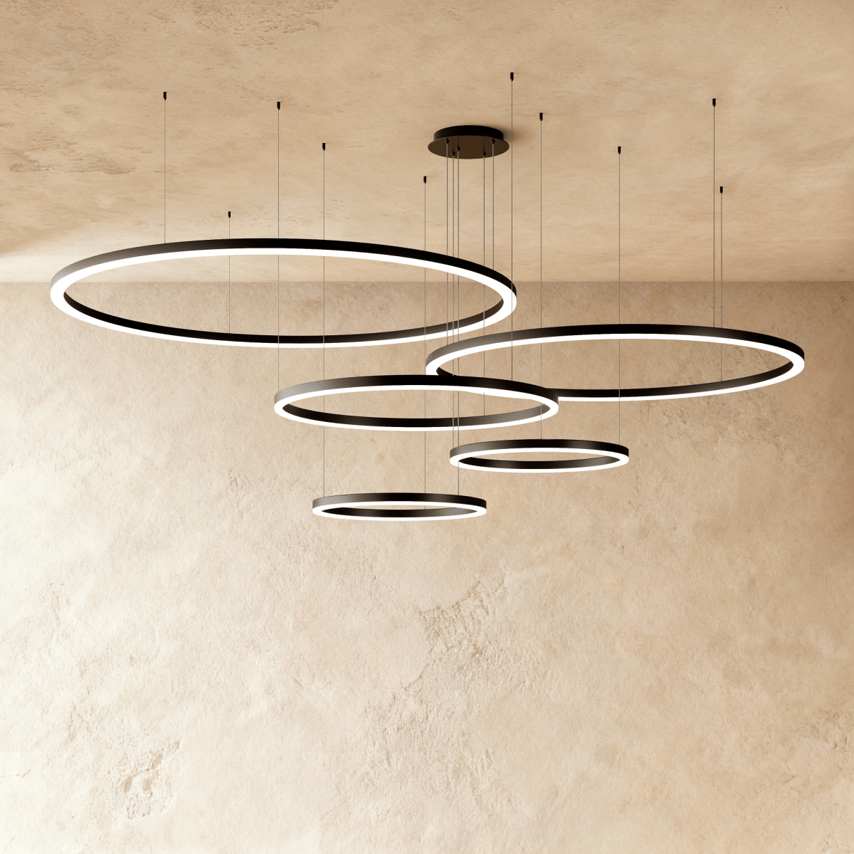Elegant Aryana Chandelier with multiple glass pendants and gold-finished metal frame, designed to enhance living room or dining area decor.