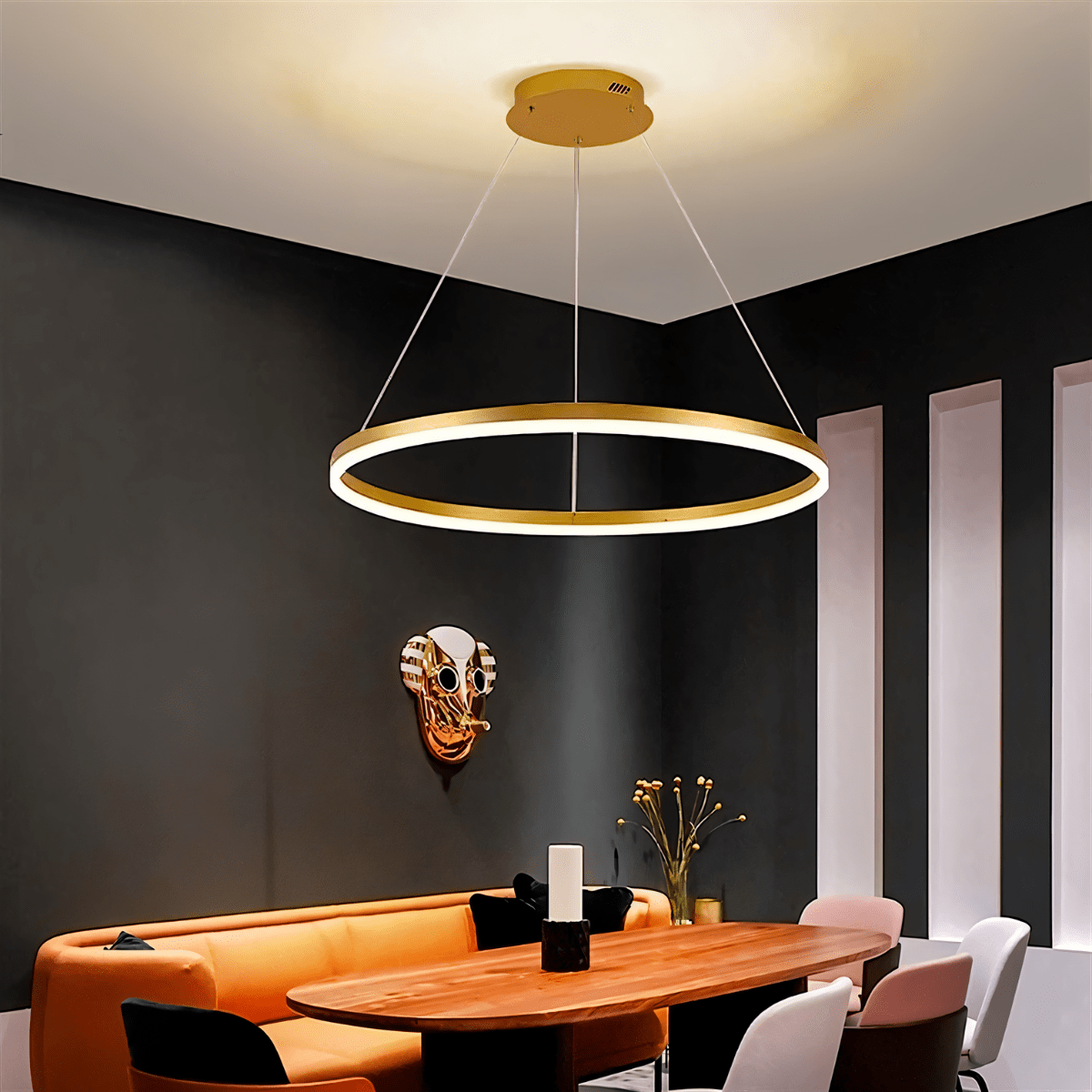 Elegant Aryana Chandelier with multiple glass pendant lights and intricate metal frame, hanging from a ceiling.
