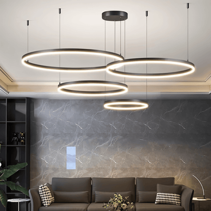 Aryana Chandelier by Residence Supply featuring elegant hanging crystal lights with a modern design and metallic finish.