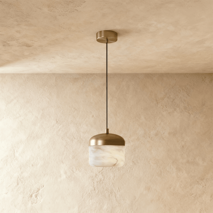 Asta Alabaster Pendant Light by Residence Supply featuring a smooth alabaster glass shade hanging from a sleek fixture.