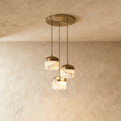 Asta Alabaster Pendant Light by Residence Supply hanging from ceiling with a smooth alabaster shade and modern design.