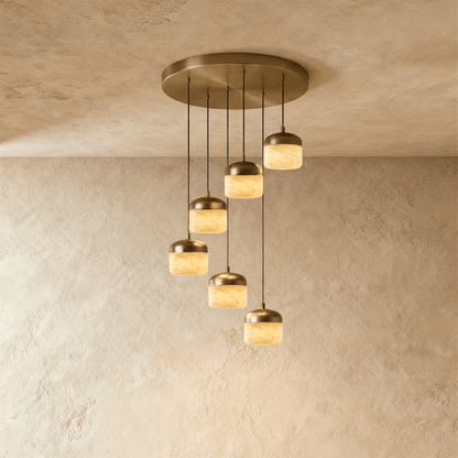 Asta Alabaster Pendant Light by Residence Supply hanging with a smooth alabaster shade and metal fixture, ideal for modern decor.