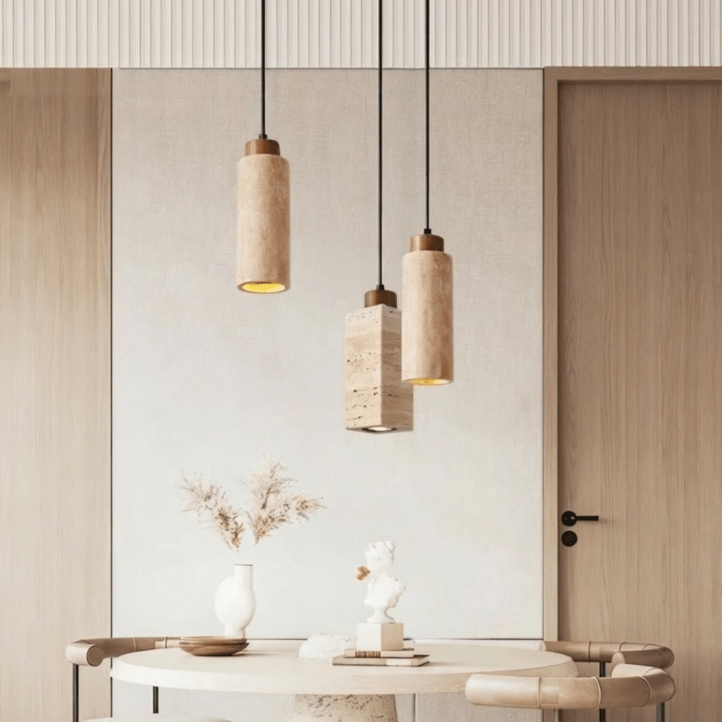 Aveno pendant light by Residence Supply hanging from ceiling with a modern design and warm lighting in a contemporary room.