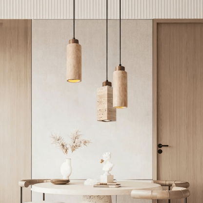 Aveno pendant light by Residence Supply hanging from ceiling with a modern design and warm lighting in a contemporary room.