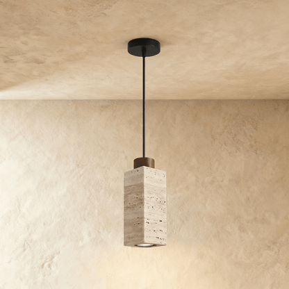 Aveno pendant light by Residence Supply hanging from ceiling with a sleek, modern design and warm illumination.