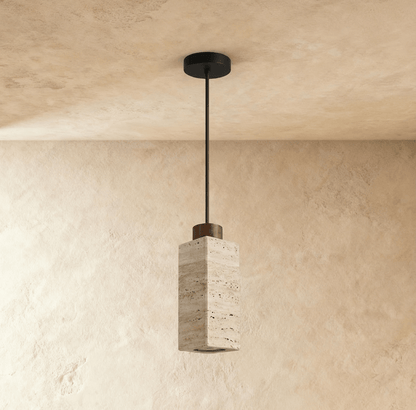 Aveno Pendant Light by Residence Supply hanging from ceiling with a sleek modern design and warm lighting in a contemporary interior