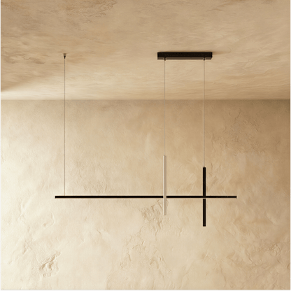 Avery Pendant Light by Residence Supply hanging from ceiling with a sleek, modern design and clear glass shade.