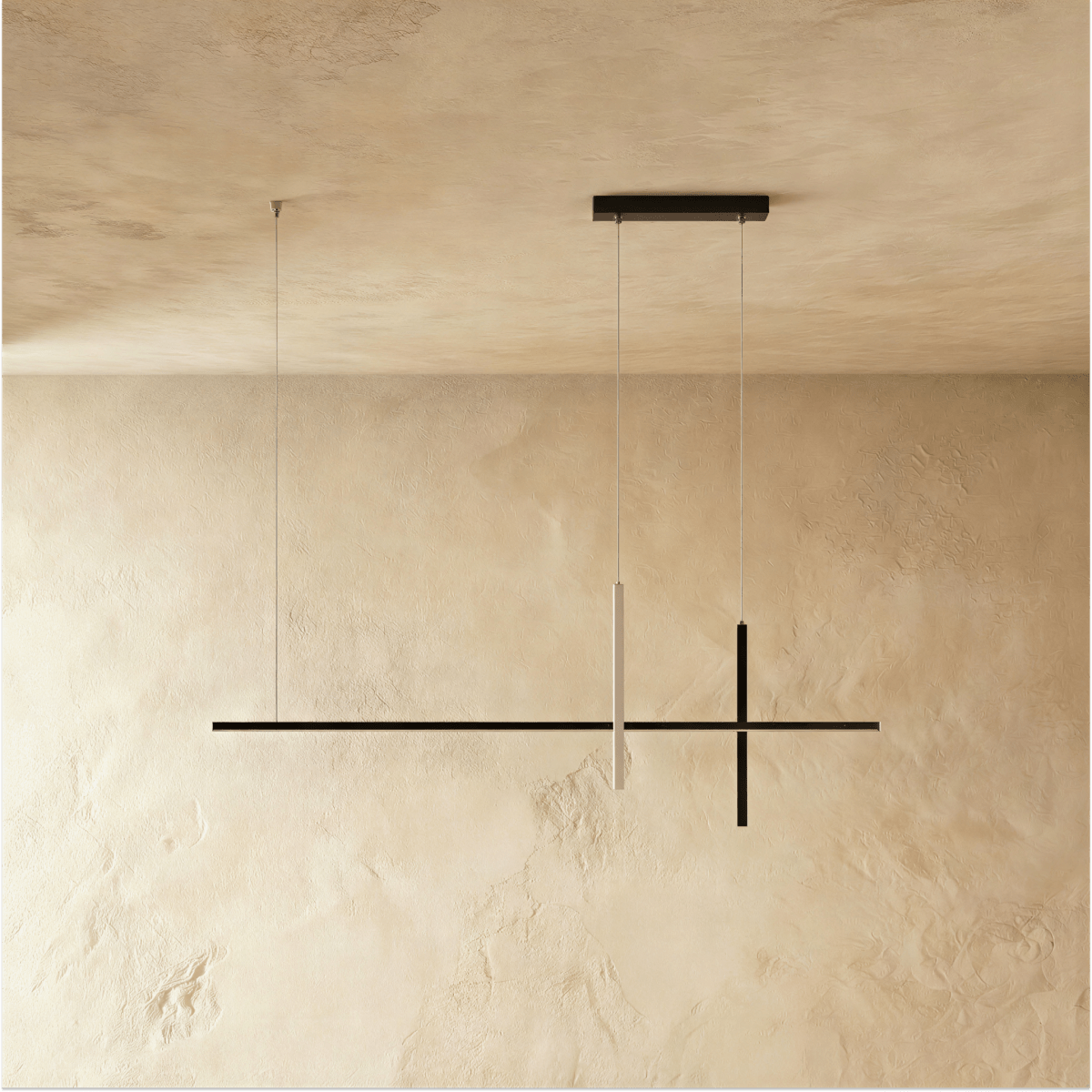 Avery pendant light by Residence Supply with a sleek, modern design and a metallic finish hanging from the ceiling.
