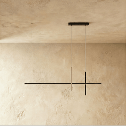 Avery pendant light by Residence Supply with a sleek, modern design and a metallic finish hanging from the ceiling.