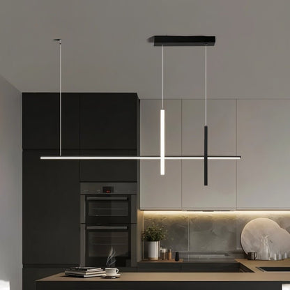 Avery Pendant Light by Residence Supply hanging from ceiling, featuring a modern design with a sleek metal finish and glass shade.