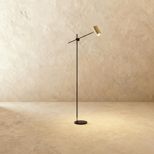 Bellis Floor Lamp by Residence Supply featuring a sleek modern design with a tall, curved metal stand and a round fabric lampshade.