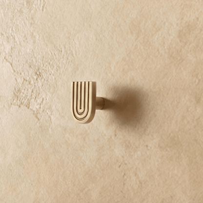 Residence Supply Blaris knob and pull bar, modern cabinet hardware for kitchen or furniture, in a sleek metallic finish.