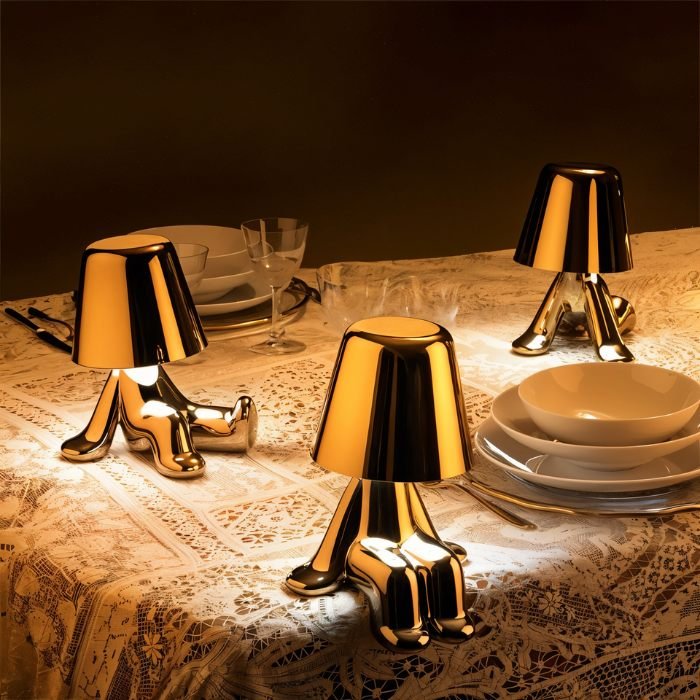 Carine Table Lamp by Residence Supply featuring a modern design with a fabric shade and sleek base on a wooden surface.