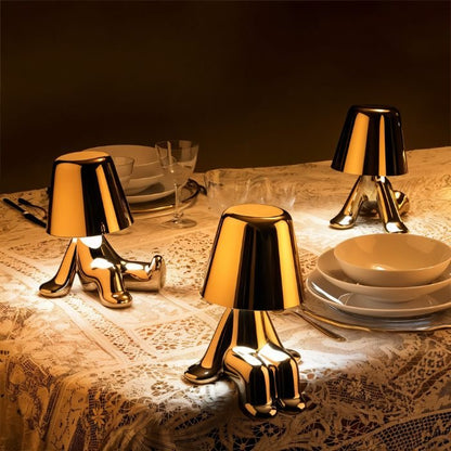 Carine Table Lamp by Residence Supply featuring a modern design with a fabric shade and sleek base on a wooden surface.