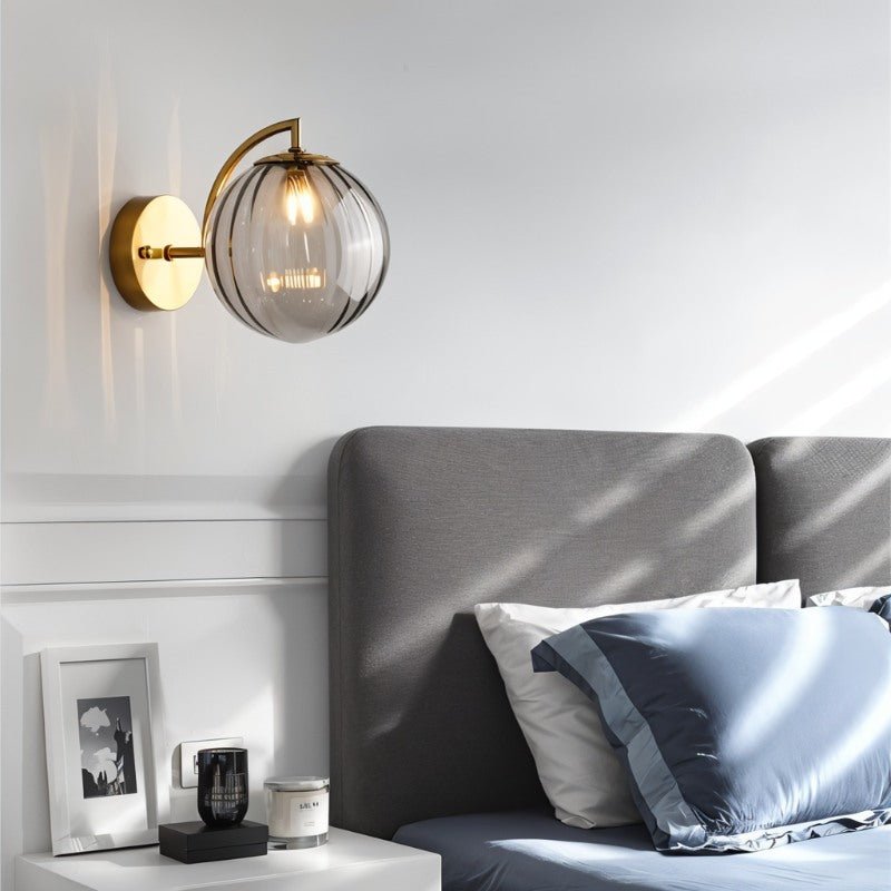 Carissa Wall Lamp by Residence Supply with a modern design and metal finish, mounted on a wall with soft lighting.