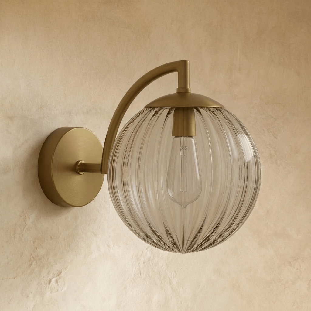 Carissa wall lamp by Residence Supply featuring a modern design with a sleek metal finish and a curved arm for stylish lighting.