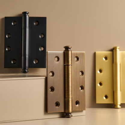 Decorative Carvin door hinges with finials in various finishes, made for home and garden door hardware applications.