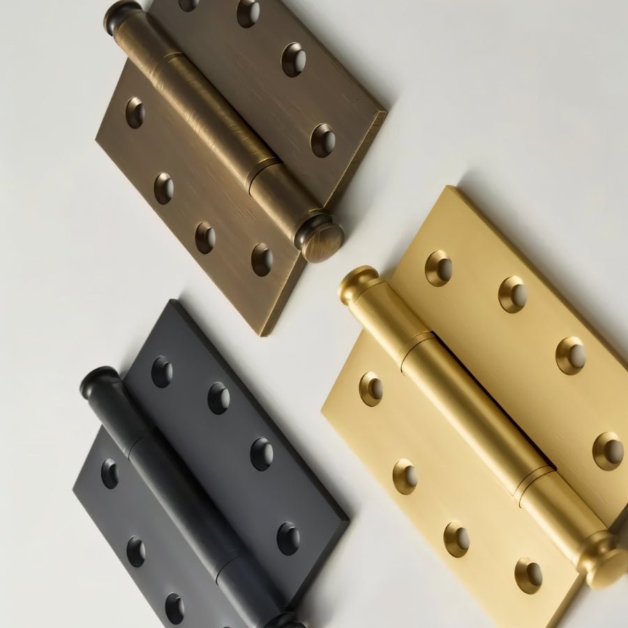 Close-up of Carvin door hinges in various finishes, showcasing durable hardware for home door installation by Residence Supply.