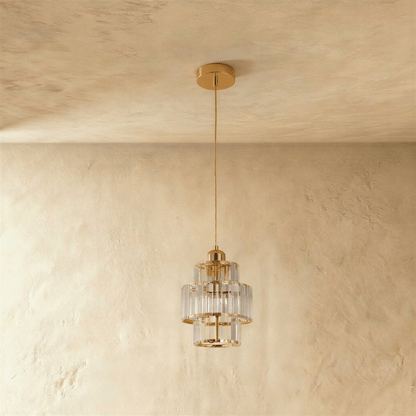 Residence Supply Charagh pendant light with a sleek, modern design and a metallic finish, hanging from a ceiling fixture.
