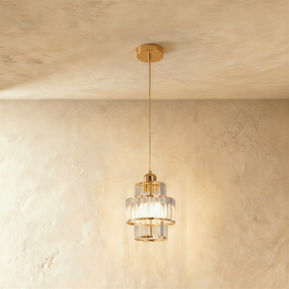 Charagh Pendant Light by Residence Supply hanging with a modern design, featuring a sleek metal frame and clear glass shade.