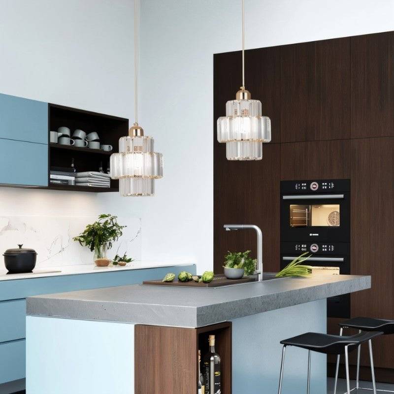 Charagh Pendant Light by Residence Supply featuring a modern design with a sleek metal finish and clear glass shade.