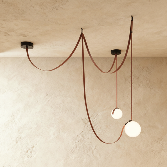 Corium Leather Glass Chandelier by Residence Supply featuring a modern design with leather and glass elements.