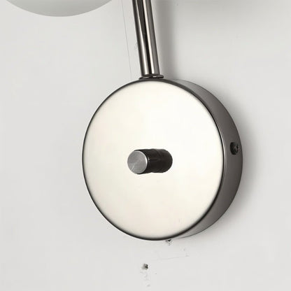 Residence Supply Crickle Wall Lamp mounted on a wall with a sleek design and warm lighting in a modern interior setting.