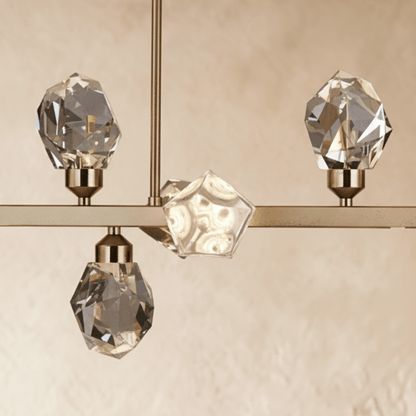 Elegant crystal chandelier with multiple hanging prisms and metal frame, designed to add luxury to living spaces.