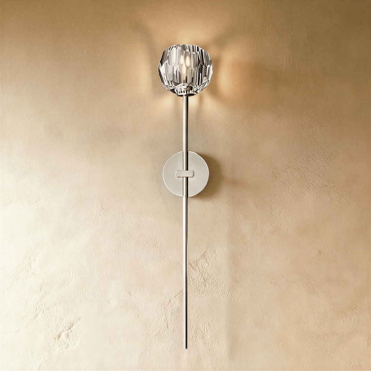 Cristo wall lamp by Residence Supply featuring a modern design with a sleek metal finish and a mounted light fixture.