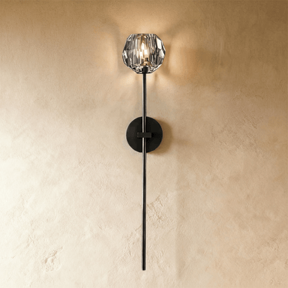 Cristo wall lamp by Residence Supply featuring a modern design with a sleek metal finish and a curved arm for stylish lighting.