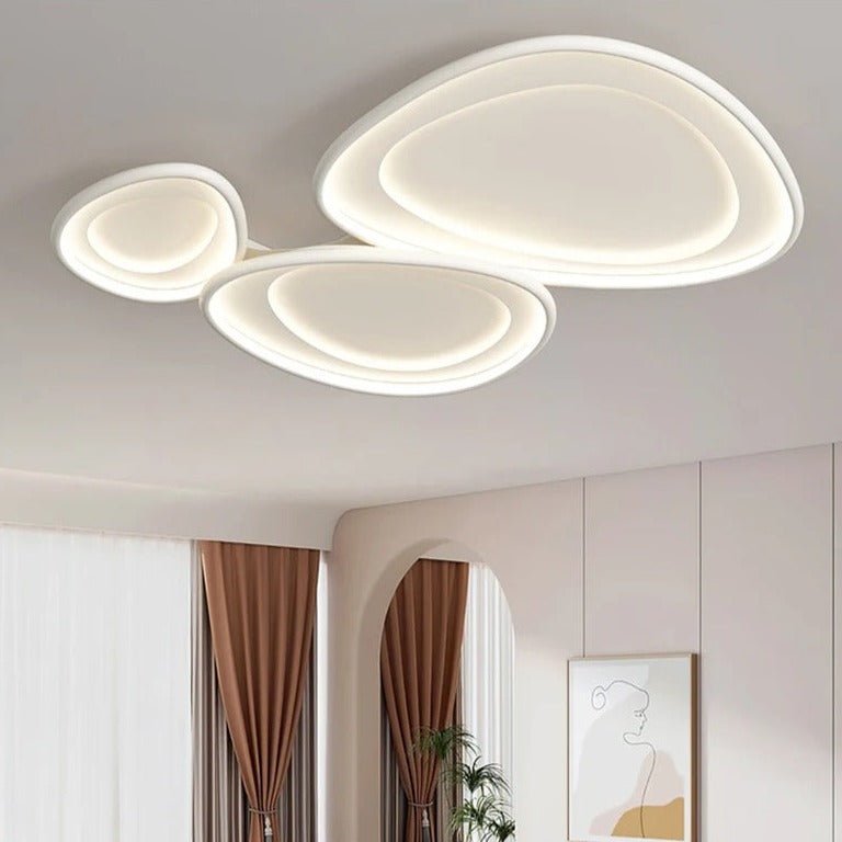 Residence Supply Cruz ceiling light fixture with a modern design and sleek metal finish, mounted on a ceiling.