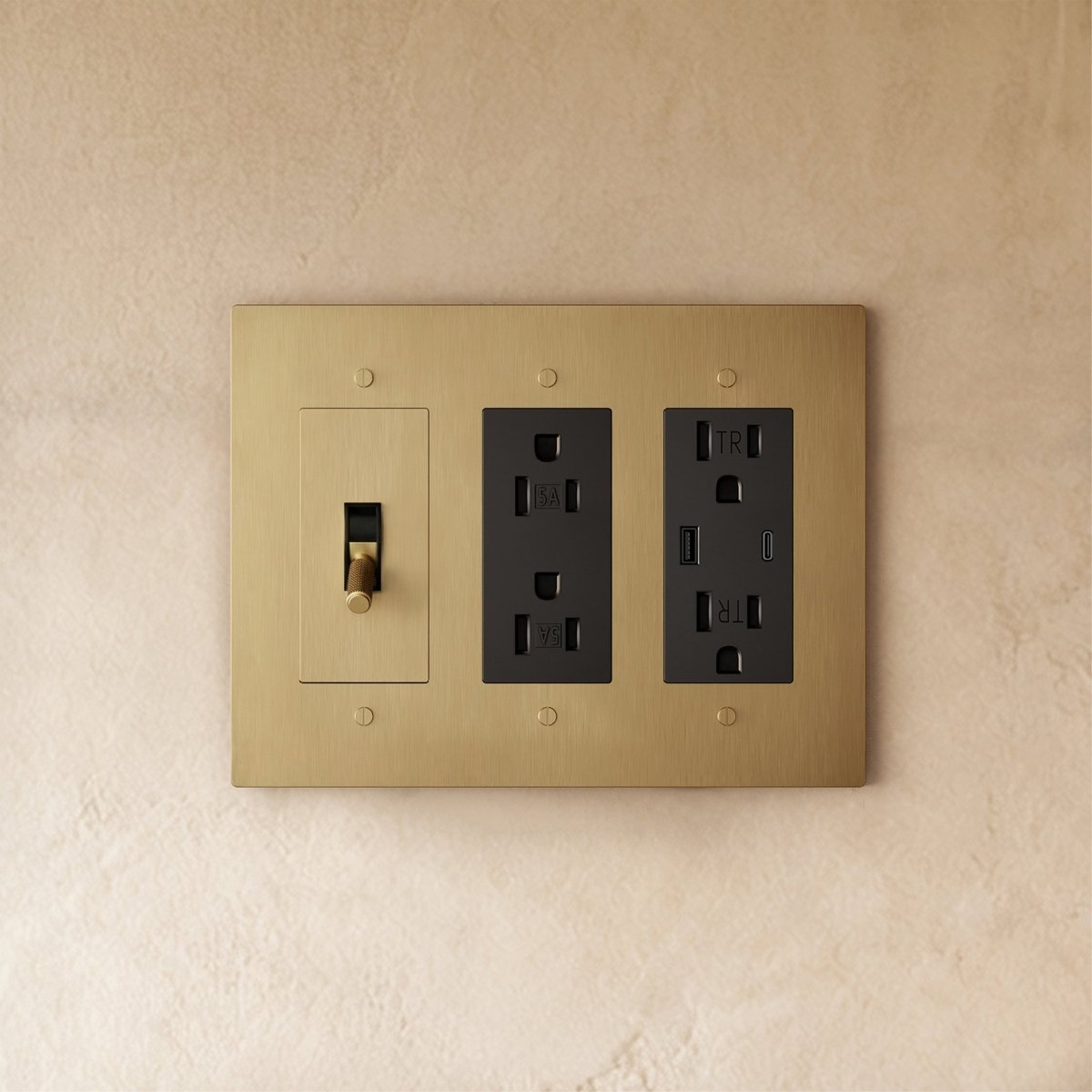 Custom brass light switch from Residence Supply, showing a sleek, vintage-style switch with brass finish and detailed craftsmanship.